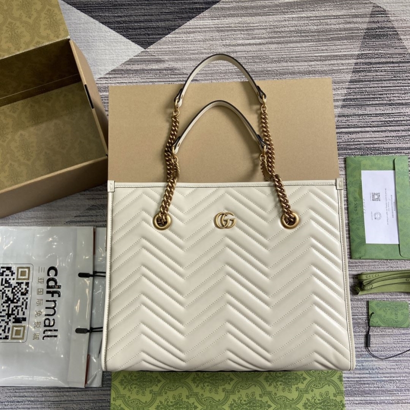 G*u*i shopping bags